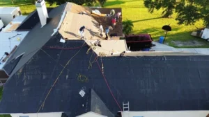 workers working on house roof
